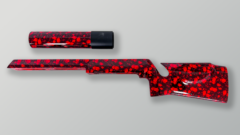 Red hydro dipped rifle stock and suppressor with custom skull pattern