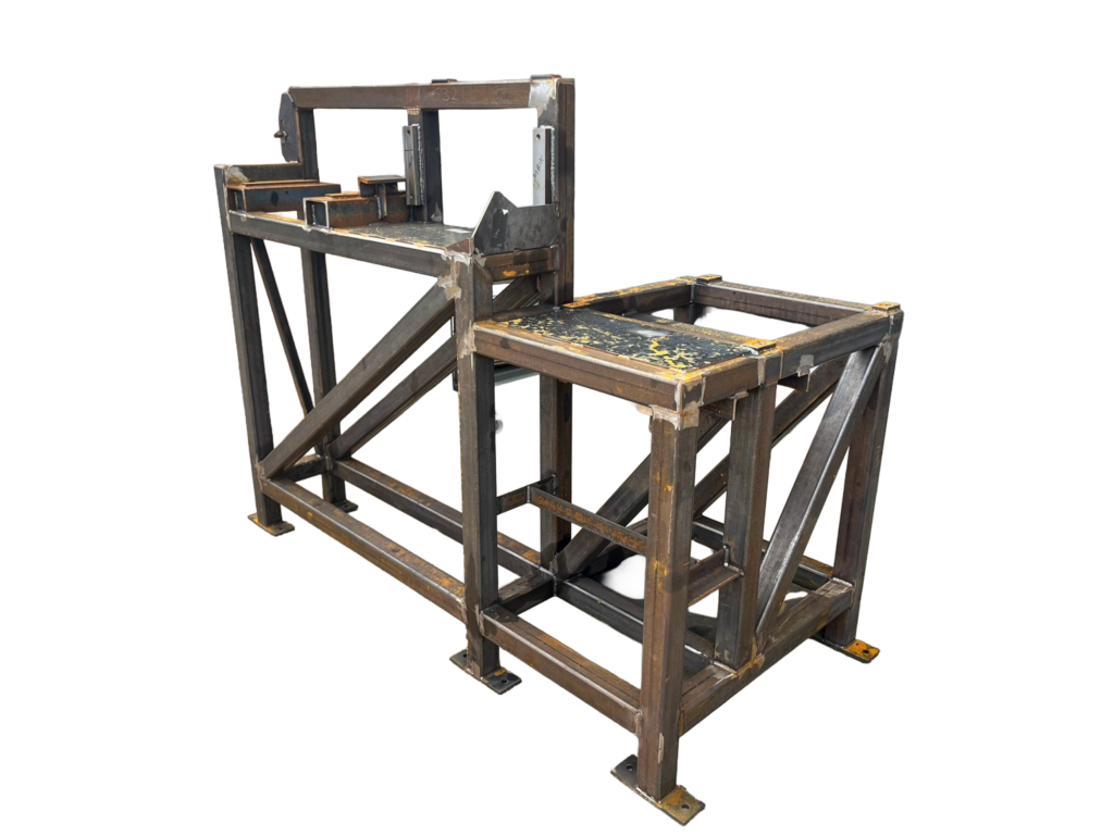 Bare fabricated steel machine frame before industrial wet spraying